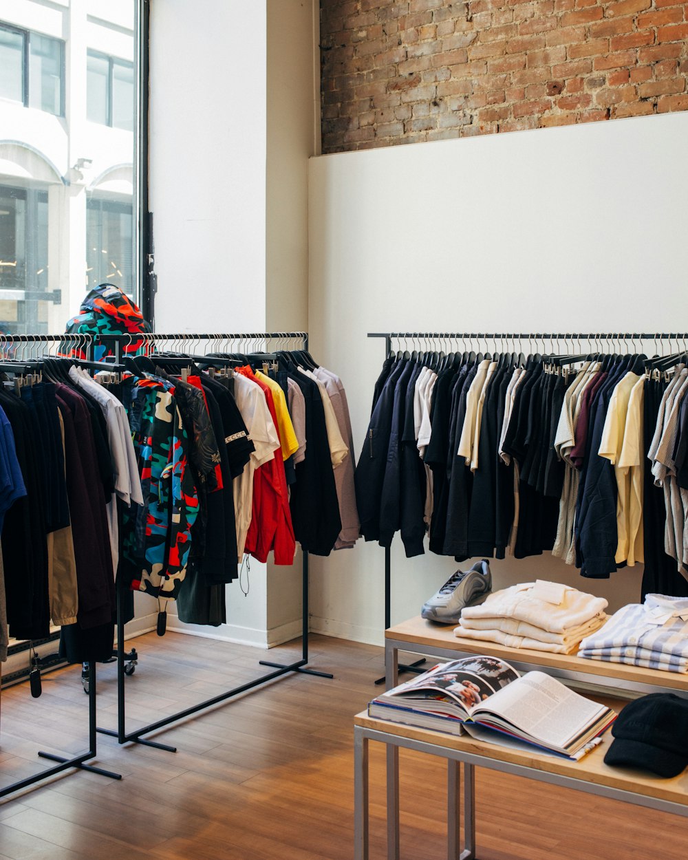 Rails of high street clothing in a busy store